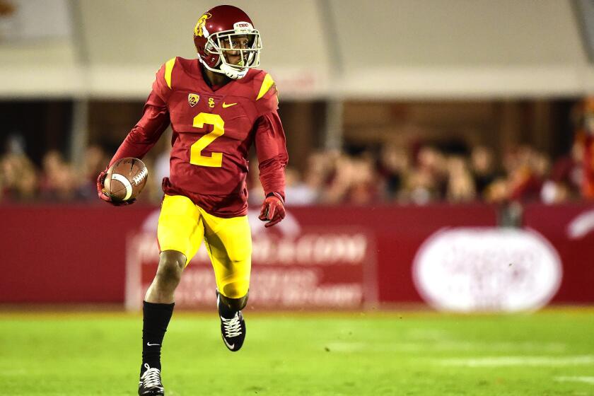 Adoree' Jackson gets a first down during the first quarter of a game against Arizona at the Coliseum on Nov. 7.