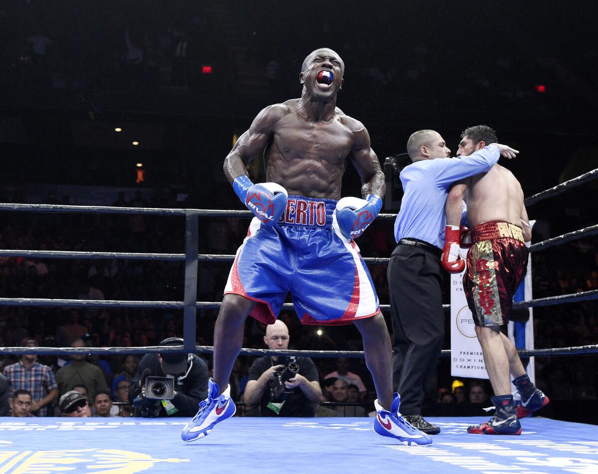 Andre Berto celebrates after knocking out Josesito Lopez in the sixth round of their welterweight bout at Citizens Business Bank Arena on March 13.