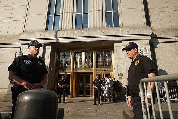 Courthouse security stand in front of Federal District Court in Manhattan at a sentencing hearing for Bernard L. Madoff, who was convicted and sentenced to 150 years on June 29, 2009 for running a multibillion-dollar Ponzi scheme. Madoff`s lawyer had asked for a 12-year sentence.