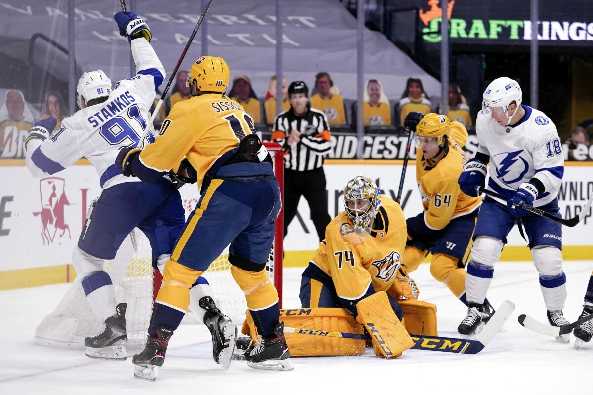 Tampa Bay Lightning center Steven Stamkos scores a goal against Nashville Predators goaltender Juuse Saros.