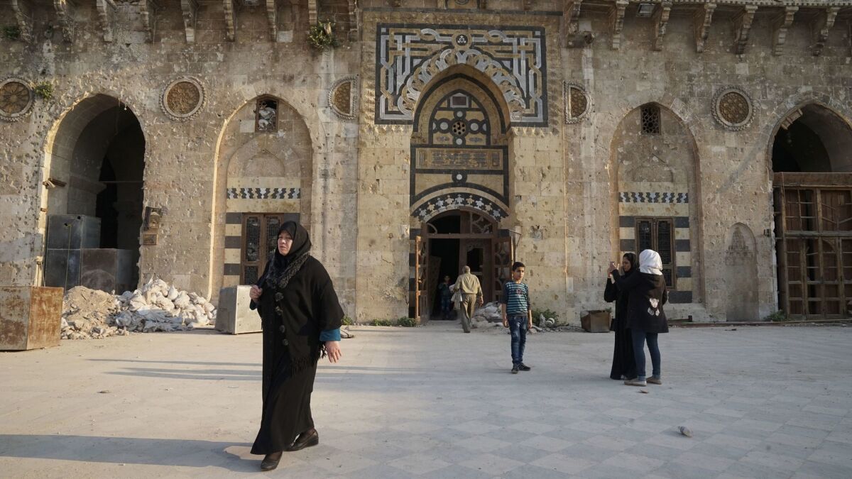 With Aleppo now back under Syrian government control, many families are coming to see the mosque, a vivid symbol of Aleppo.