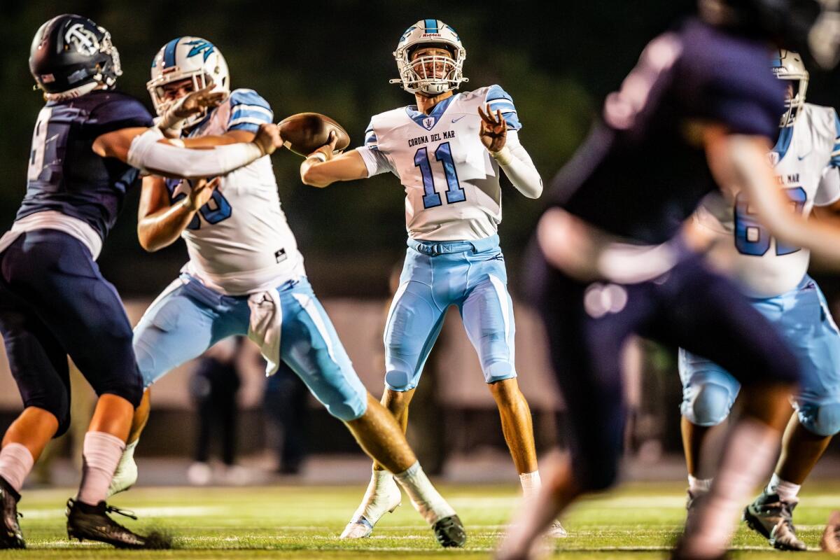 Corona del Mar High senior quarterback Kaleb Annett throws downfield on Friday night at