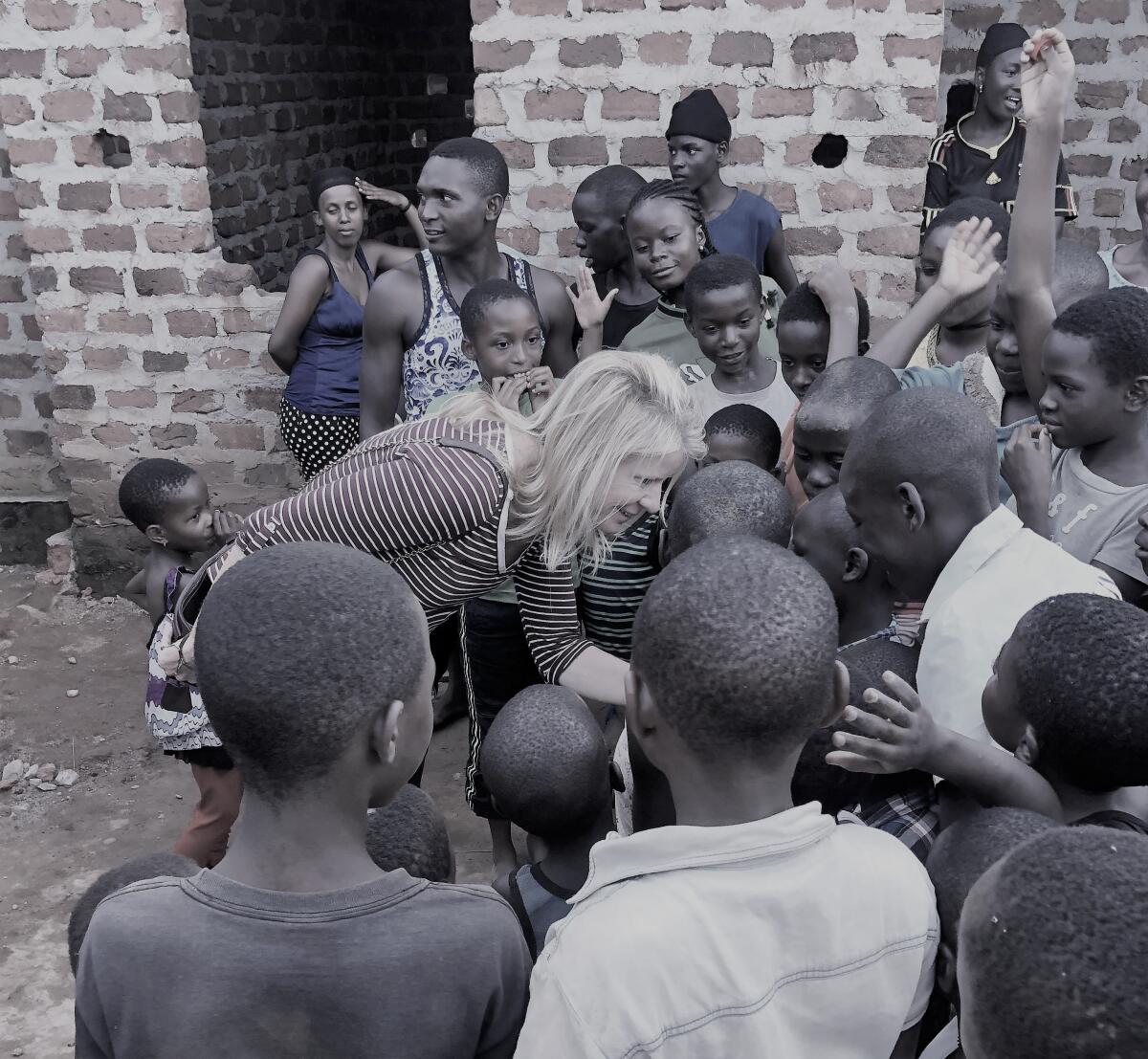 Jaye Connolly-LaBelle with children at the Wembly Mo Orphanage in Uganda.