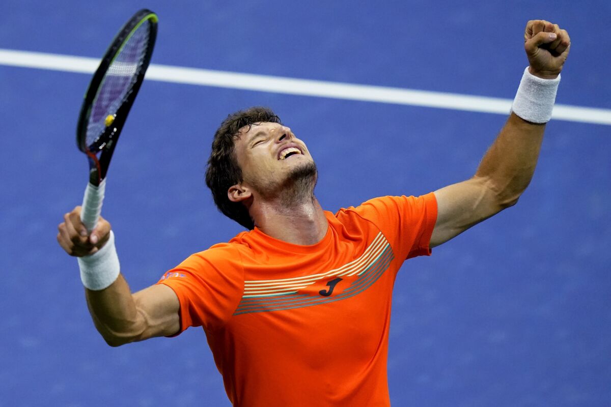 Pablo Carreno Busta, of Spain, reacts after defeating Denis Shapovalov, of Canada, during the quarterfinal round of the US Open tennis championships, early Wednesday, Sept. 9, 2020, in New York. (AP Photo/Frank Franklin II)