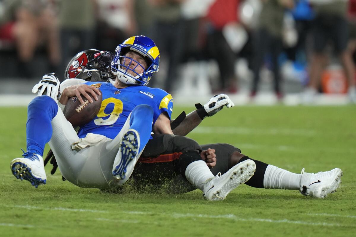 Los Angeles Rams quarterback Matthew Stafford (9) is sacked by Tampa Bay Buccaneers defensive tackle Rakeem Nunez-Roches during the second half of an NFL football game between the Los Angeles Rams and Tampa Bay Buccaneers, Sunday, Nov. 6, 2022, in Tampa, Fla. (AP Photo/Chris O'Meara)
