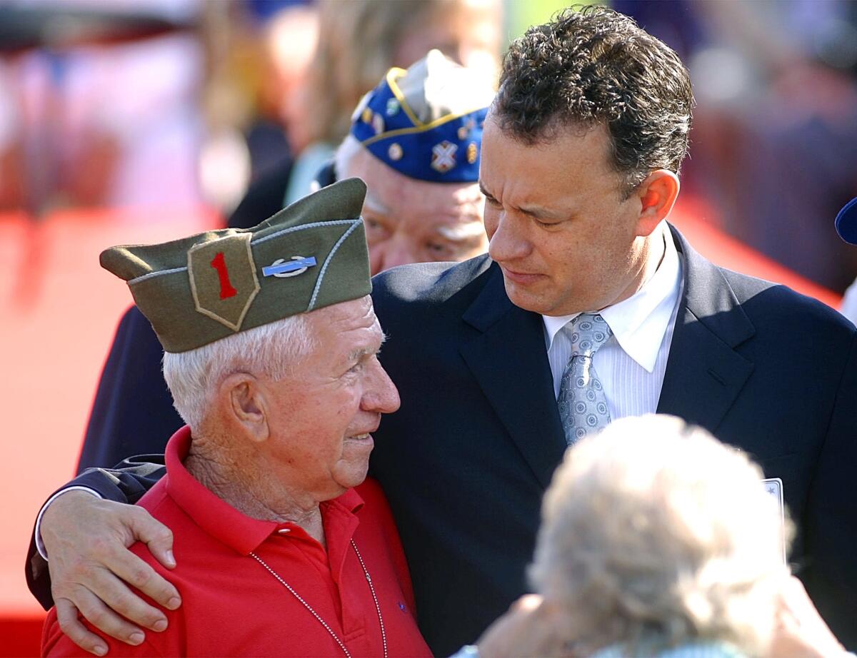 U.S. actor Tom Hanks, right, with an unidentified World War II veteran at the American cemetery in Colleville–sur–mer, northwestern France, on June 6, 2004, during ceremonies marking the 60th anniversary of the D–Day landings in Normandy.