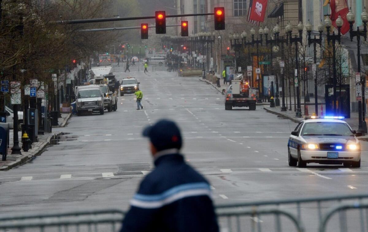 Officials were slowly reopening Boylston Street in Boston to residents and business owners Tuesday after the April 15 Boston Marathon bombings.