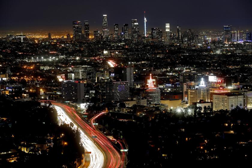 LOS ANGELES, CALIF. -- WEDNESDAY, NOVEMBER 22, 2017: The Los Angeles skyline from Mulholland Scenic Overlook on Thanksgiving Eve in Los Angeles, Calif., on Nov. 22, 2017. (Gary Coronado / Los Angeles Times)