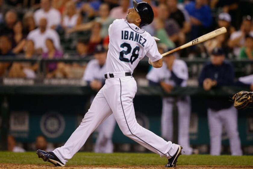 Raul Ibanez takes a swing for the Seattle Mariners in September.