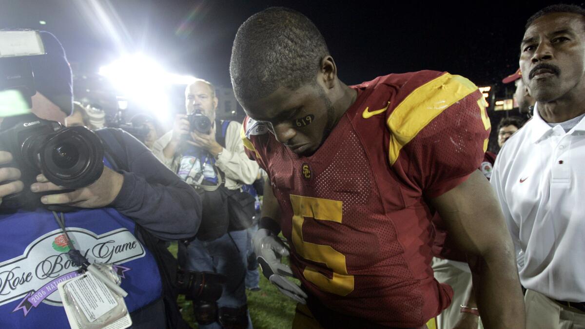 Reggie Bush leaves the field after the Trojans lost to the Texas Longhorns for the national championship at the Rose Bowl.