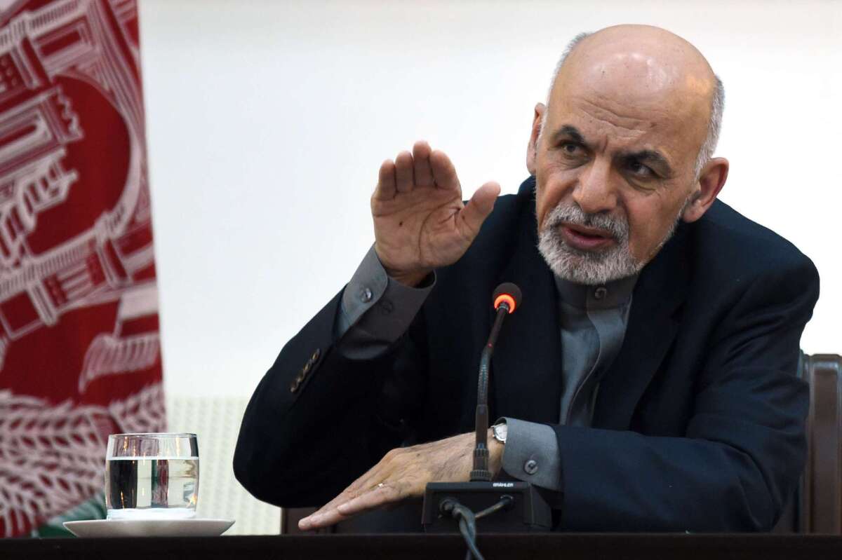 Afghan President Ashraf Ghani speaks to journalists at the presidential palace in Kabul on March 21.