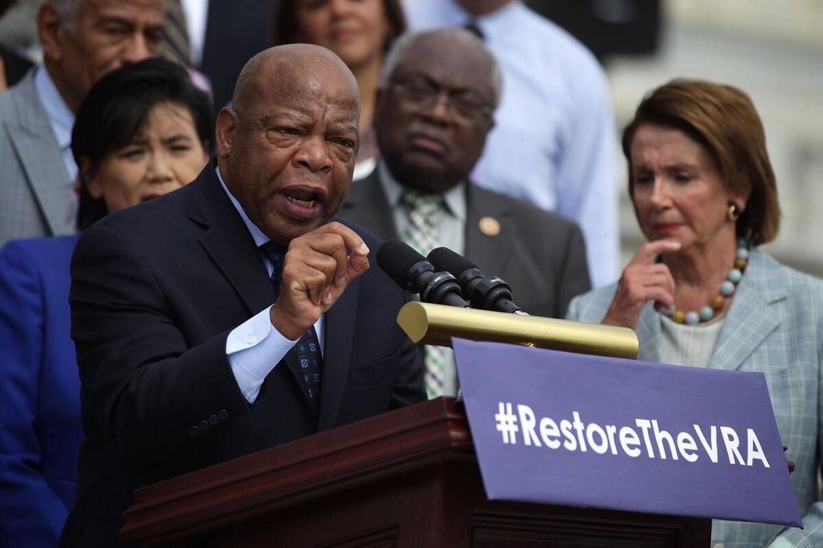 Rep. John Lewis (D-Ga.) speaks on Capitol Hill during a rally on July 30 to commemorate the 50th anniversary of the Voting Rights Act.