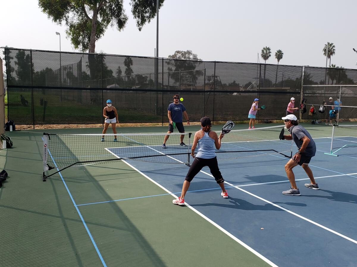 Jodi and David Traver (back) and Kate and Keith Frankel (front) play pickleball at San Diego Pickleball.