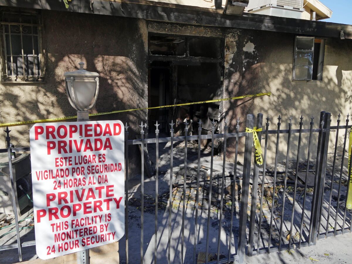 Police tape marks off the burned front lobby of the Islamic Center of Palm Springs in Coachella on Dec. 12.