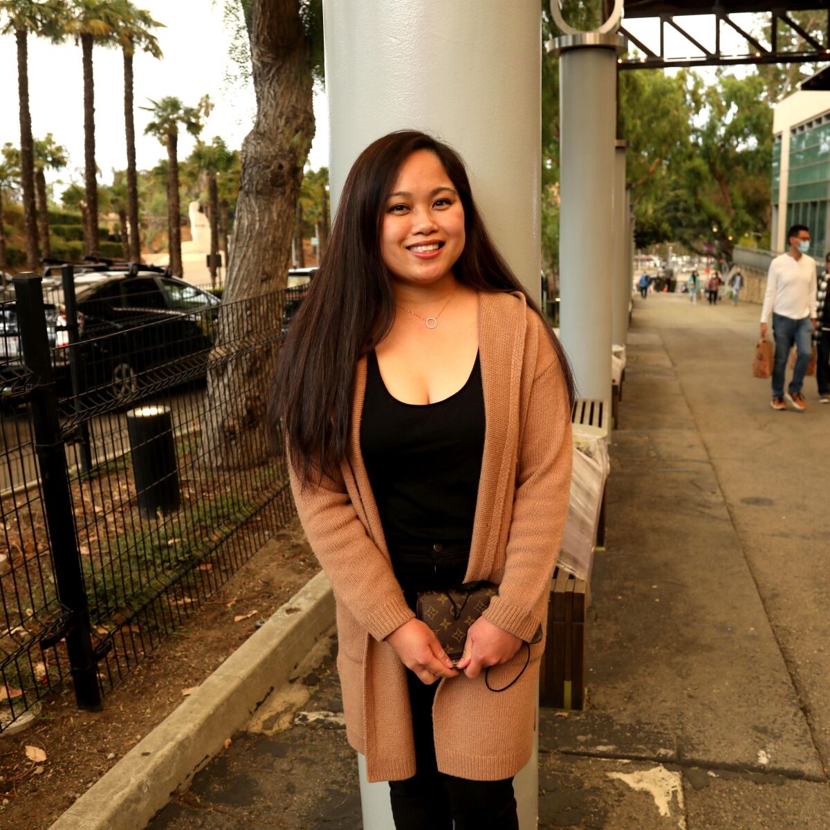 A woman poses for a photo.