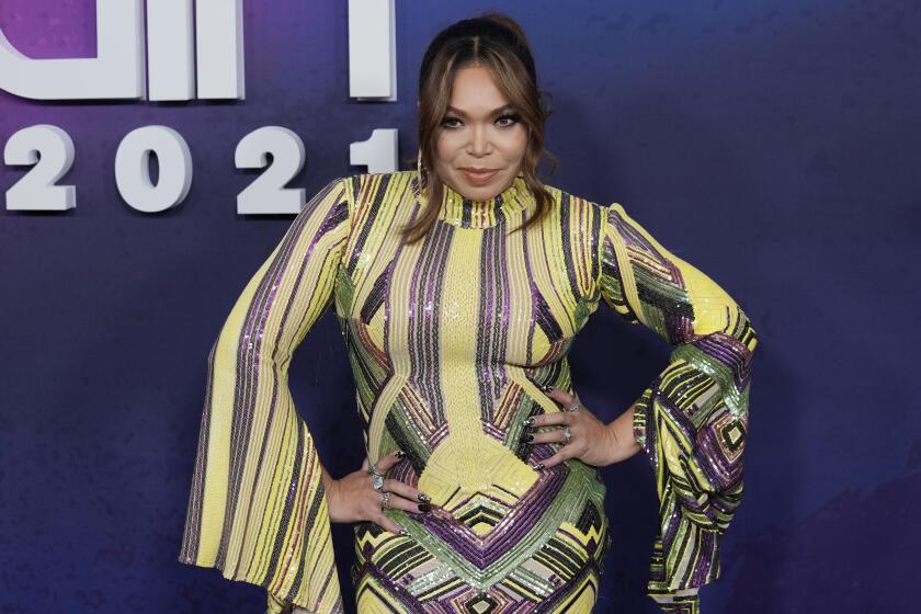Tisha Campbell poses after arriving at an awards show