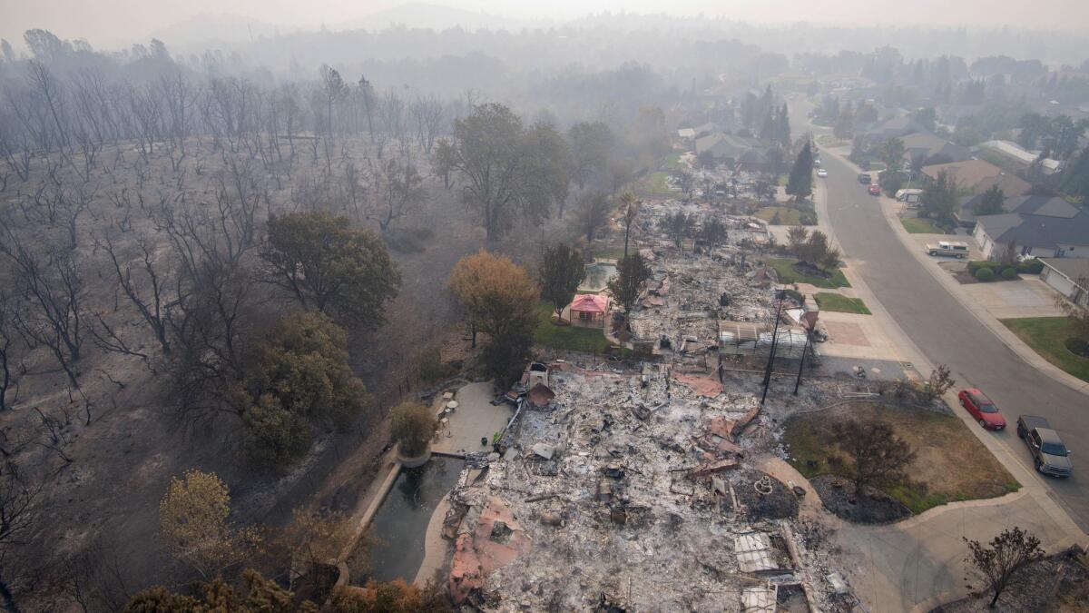 The deadliest fire in California so far this year, the Carr fire in Shasta and Trinity counties, was fully contained Thursday night, officials said. Pictured above are homes destroyed in the Mary Lake Subdivision.