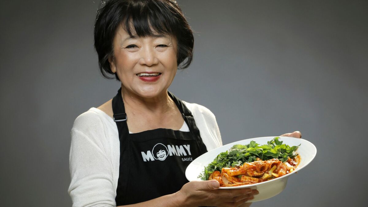 Jai Nam "Mommy Choi" Choi, makes a traditional spicy Korean rice cake dish — tteokbokki.