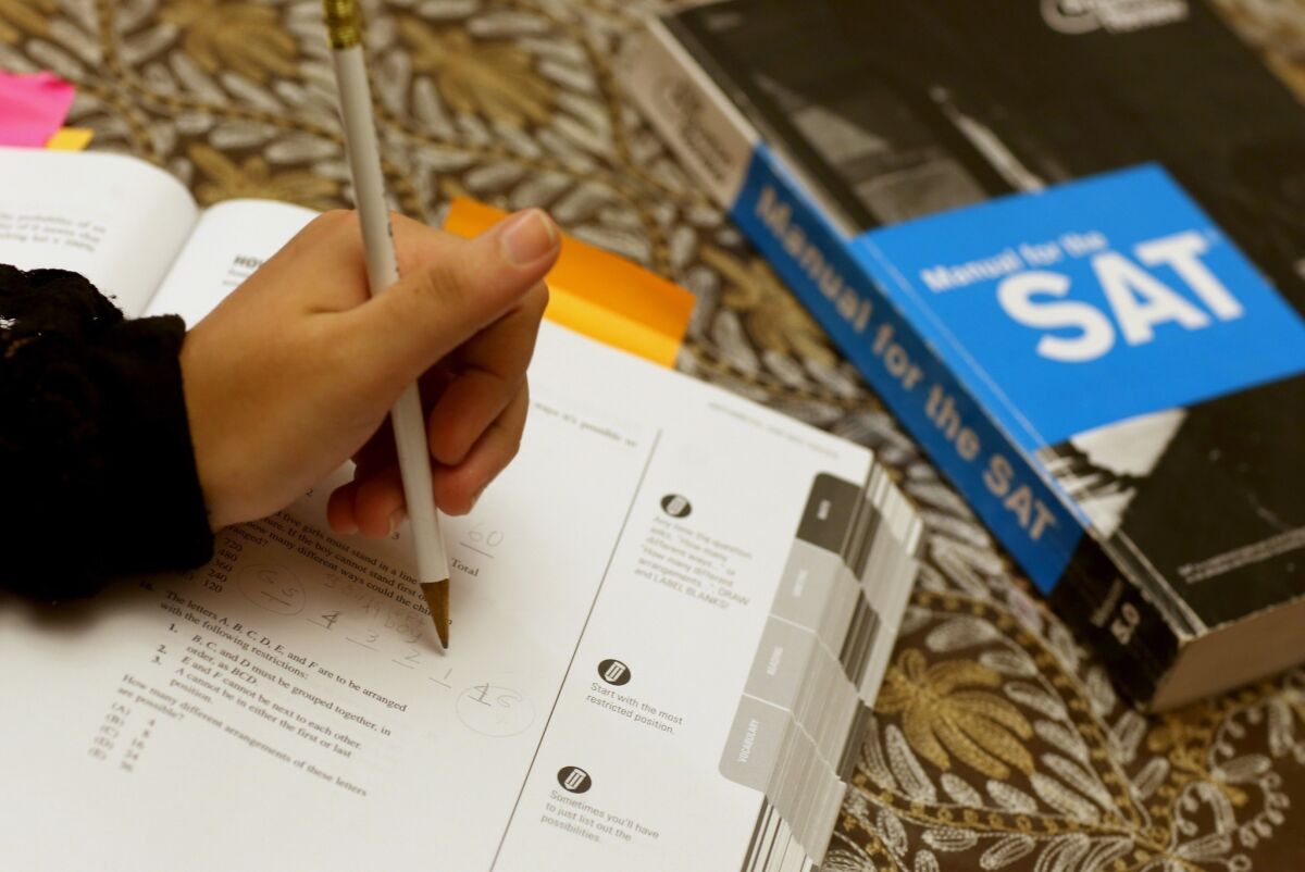 A student answers a practice question for the SAT test.