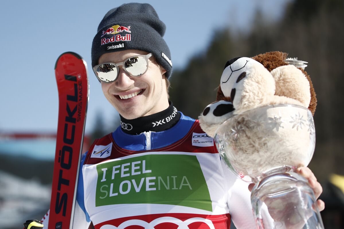 Second placed Switzerland's Marco Odermatt celebrates after an alpine ski, men's World Cup giant slalom race, in Kranjska Gora, Slovenia, Saturday, March 12, 2022. (AP Photo/Gabriele Facciotti)