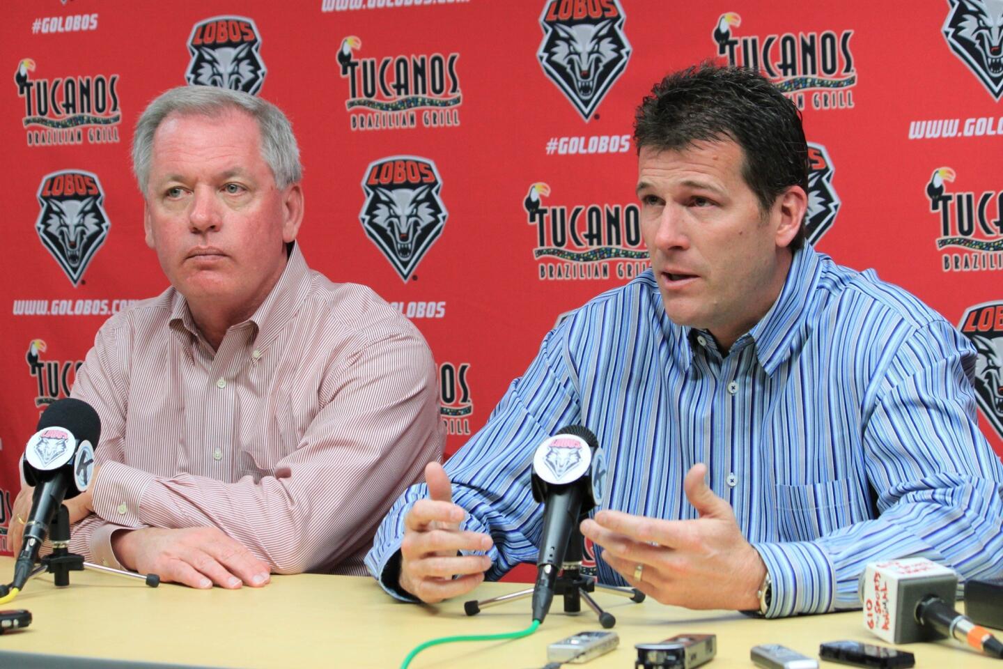 Steve Alford, with New Mexico Athletic Director Paul Krebs at his right, addresses the media after accepting the UCLA coaching job.
