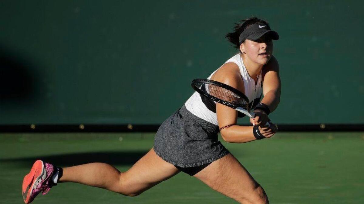 Bianca Andreescu returns a shot to Eugenie Bouchard during their match on Friday.