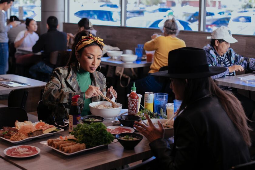 VAN NUYS, CA - NOVEMBER 09: Jeannie Mai enjoys a meal at the restaurant Pho So 1 with Jen Harris during their Vietnamese food crawl in the San Fernando Valley on Wednesday, Nov. 9, 2022 in Van Nuys, CA. (Jason Armond / Los Angeles Times)