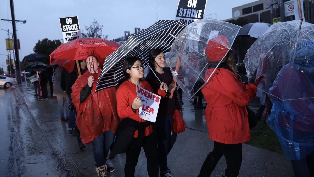 Students join LAUSD teachers in from of Roosevelt High School Monday morning as teachers walked off the job in their first strike in 30 years.