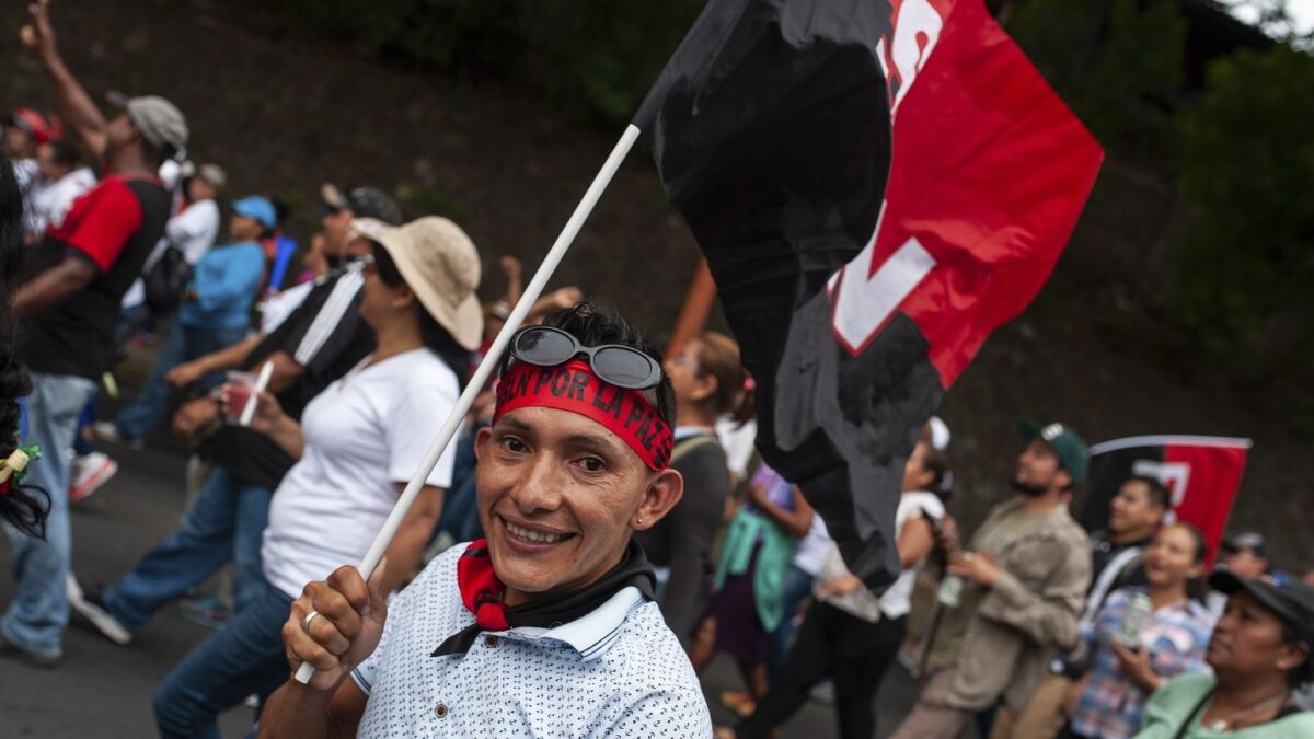 A Sandinista supporter marches in Managua, Nicaragua, on July 23, 2018.