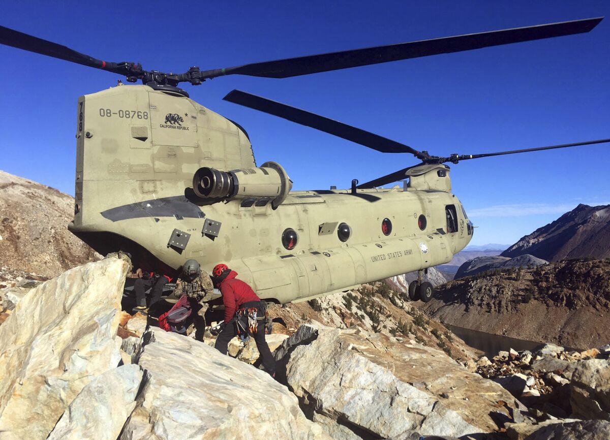 A photo provided by the Mono County Sheriff's Office shows operations Tuesday to recover the bodies of two hikers who died on Red Slate Mountain in the eastern Sierra Nevada.
