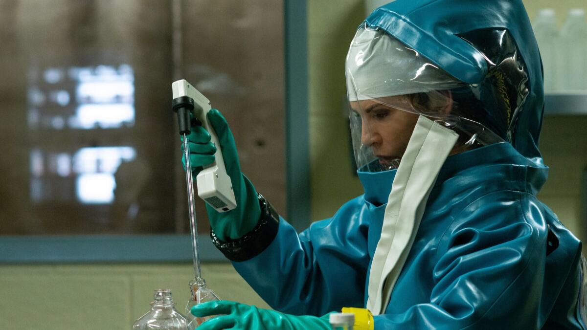 Dr. Nancy Jaax (Julianna Margulies) works in her pathology lab in a scene from the National Geographic biohazard drama, "The Hot Zone."