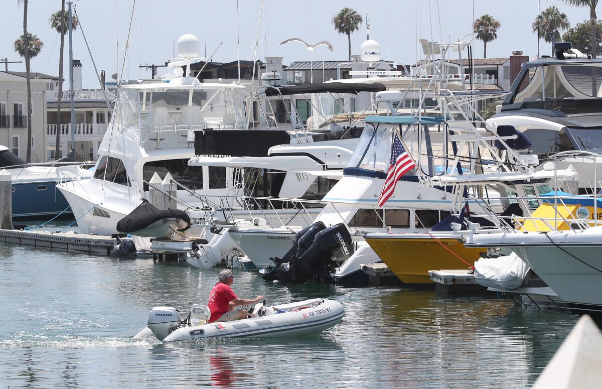 Boats are docked in the Balboa Yacht Basin marina in Newport Harbor in Newport Beach in July 2024.