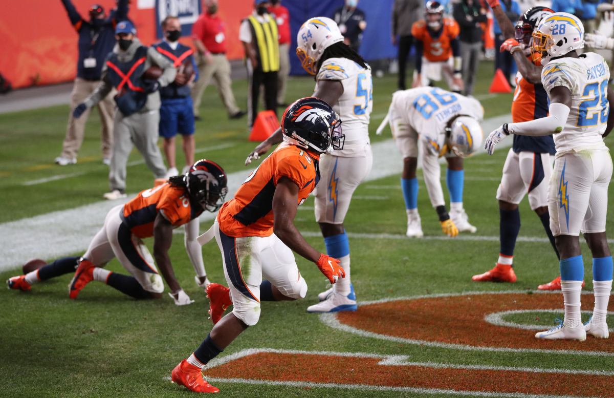 Denver Broncos wide receiver KJ Hamler runs as he celebrates his last-second touchdown.