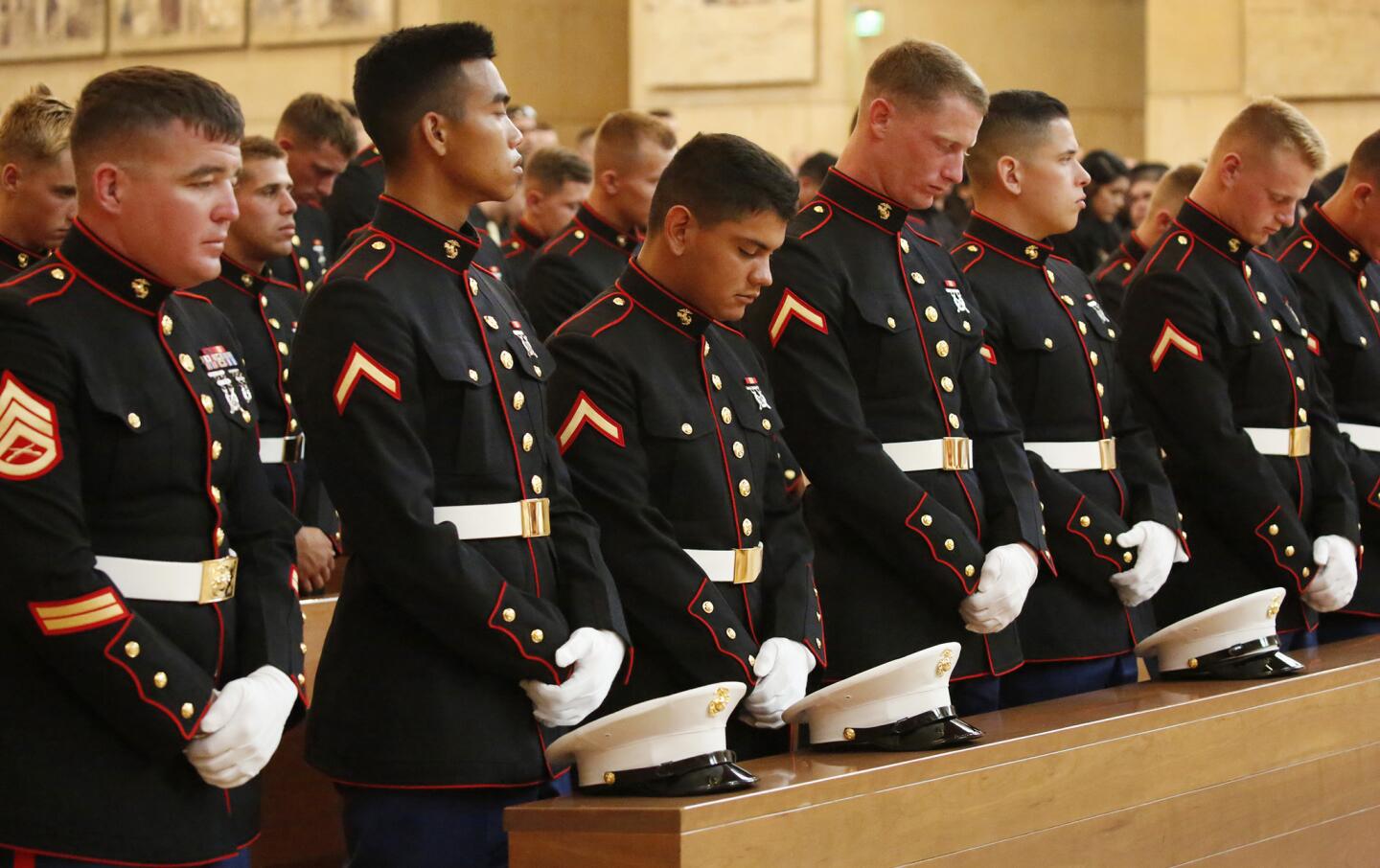 Marines bow their heads during funeral services Wednesday at the Cathedral of Our Lady of the Angels for Lance Cpl. Carlos Segovia-Lopez.