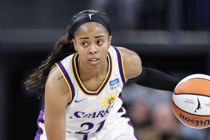 Los Angeles Sparks guard Jordin Canada brings the ball up court against the Chicago Sky during the first half of the WNBA basketball game, Friday, May 6, 2022, in Chicago. (AP Photo/Kamil Krzaczynski)