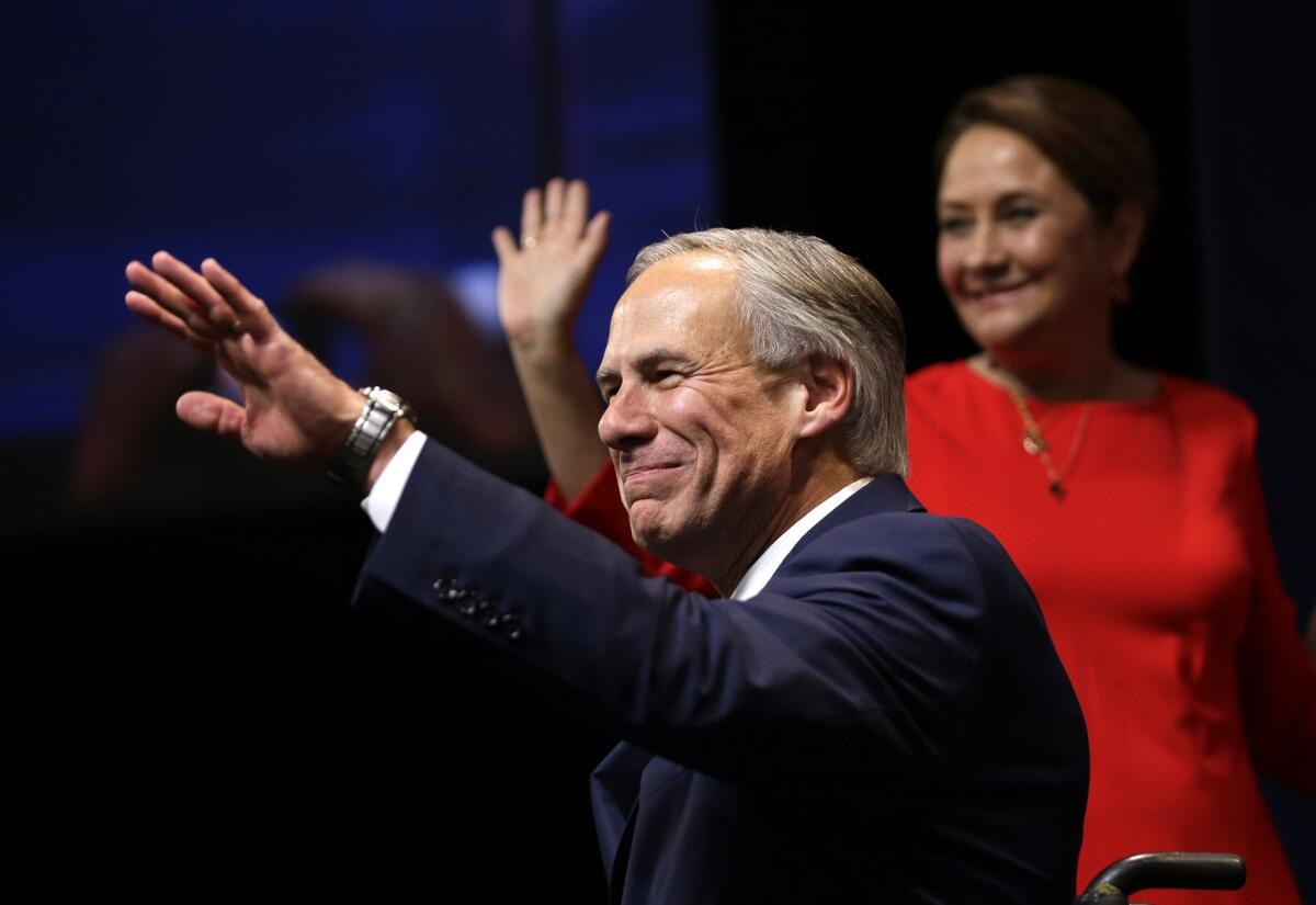 Republican Greg Abbott acknowledges supporters in Austin after winning the race for Texas governor.