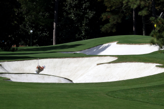 Paul Casey plays a shot from a bunker on the first hole at Augusta National Golf Club.