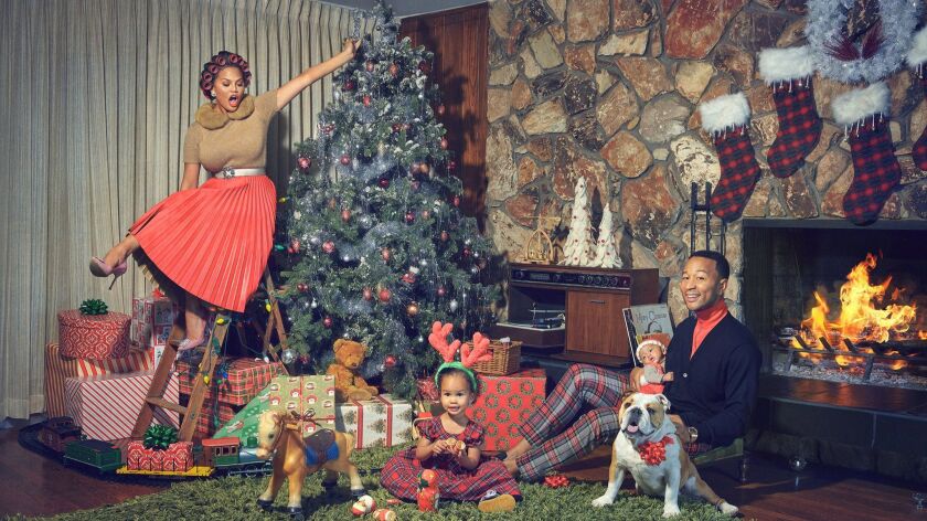 Critically acclaimed, multi-platinum singer-songwriter John Legend has released his first Christmas album, "A Legendary Christmas." Pictured: John Legend with Chrissy Teigen, daughter Luna Simone Stephens and son Miles Theodore Stephens.