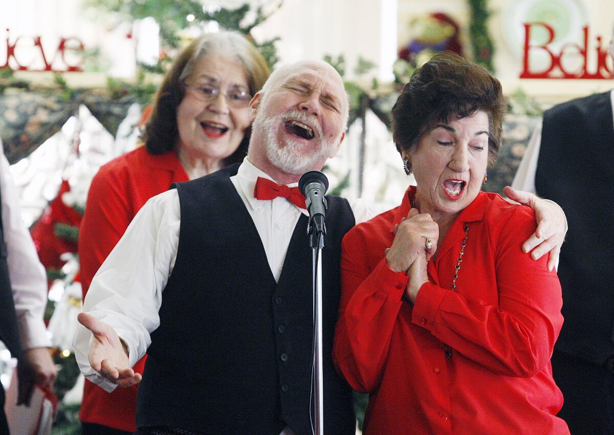 Mark Nudelman and Marcia Melcomb, of the Van Bloem Singers from Burbank, sing a duo at the Broadview Residential Care Center in Glendale on Tuesday, December 10, 2013. They sang Christmas songs, and the group, which has had several different members, has been performing for over 20 years.