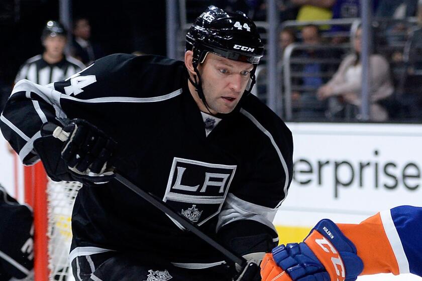 Kings defenseman Robyn Regehr chases after the puck during the team's 2-1 shootout loss to the New York Islanders on Thursday.