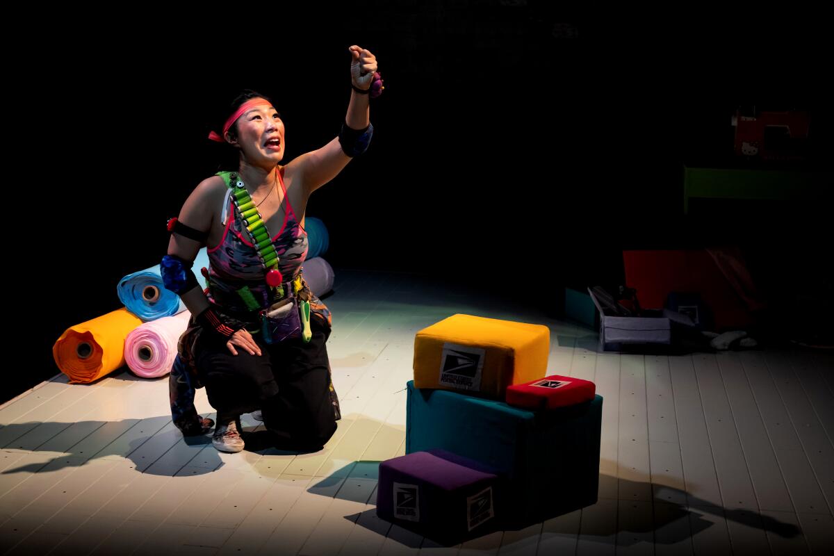 Kristina Wong in a scene from "Kristina Wong, Sweatshop Overlord" at the Kirk Douglas Theatre.