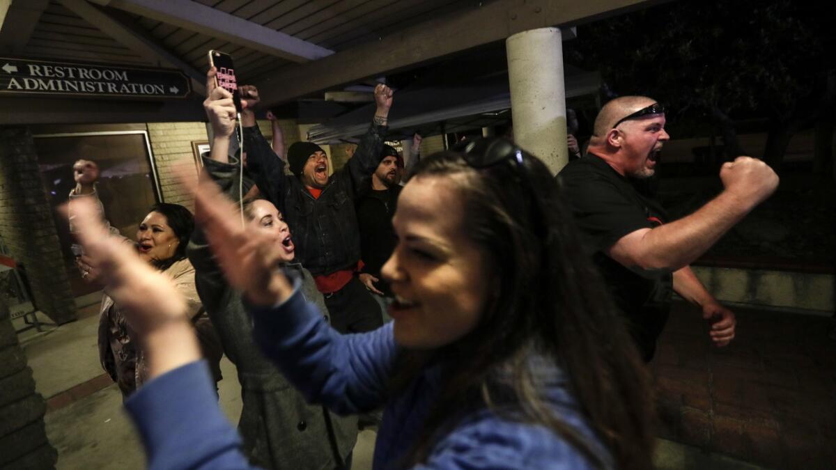 Spectators cheer the Los Alamitos City Council's vote to oppose California's "sanctuary" state law.