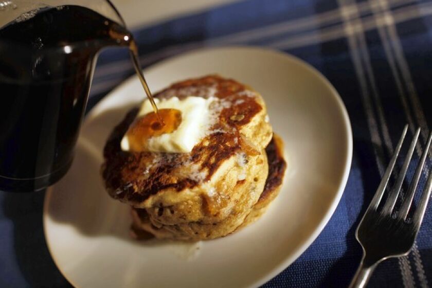 Oatmeal pancakes can be enhanced with dried fruit. And syrup, of course.