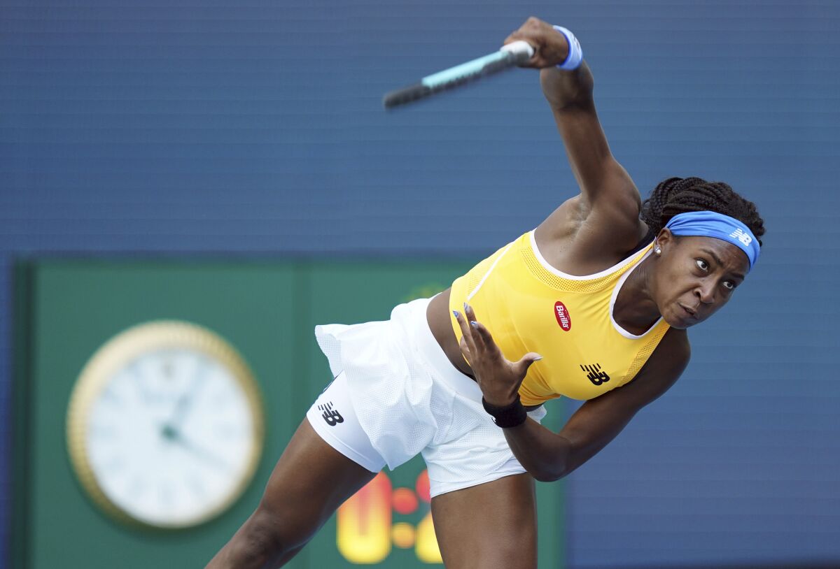 FILE - Coco Gauff, of the United States, serves to Iga Swiatek, of Poland, during the first set of the Miami Open tennis tournament, Monday, March 28, 2022, in Miami Gardens, Fla. American Gauff was knocked out in the first round of the Stuttgart Open on Tuesday, April 19, after a 6-4, 6-2 loss to Daria Kasatkina. (AP Photo/Jim Rassol, File)