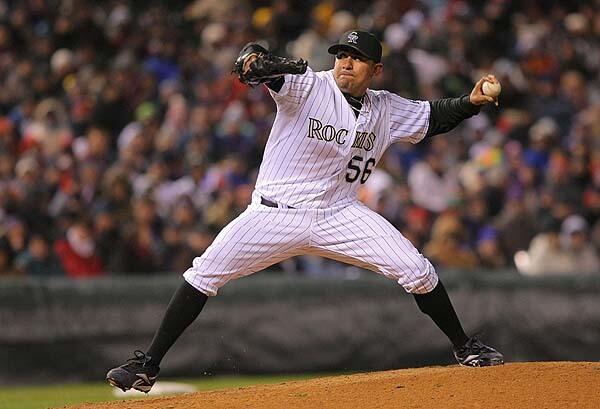 Franklin Morales #56 of the Colorado Rockies pitches against the Philadelphia Phillies in Game Three of the NLDS during the 2009 MLB Playoffs at Coors Field in Denver, Colorado.
