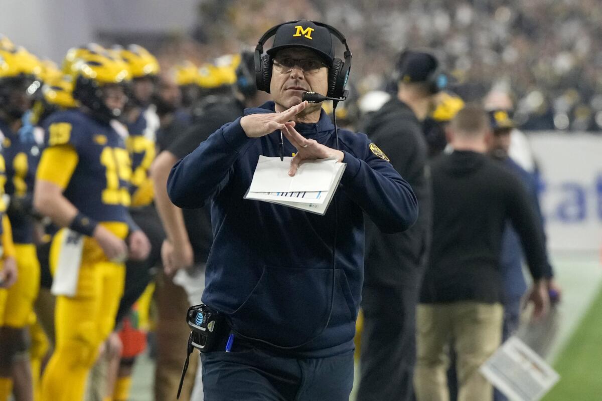 Jim Harbaugh calls Michigan president to say he's staying - The