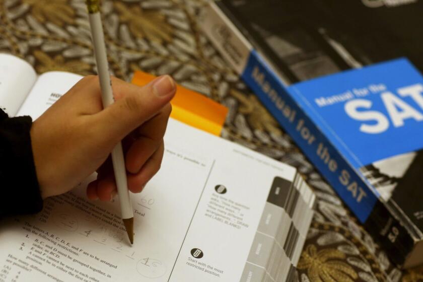 PEMBROKE PINES, FL - MARCH 06: A college applicant uses an SAT Preparation book to study for the test on March 6, 2014 in Pembroke Pines, Florida.