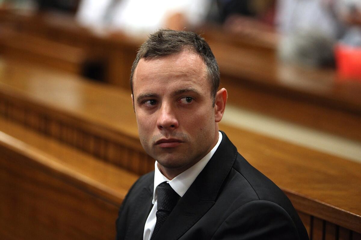 South African athlete Oscar Pistorius, accused of murdering girlfriend Reeva Steenkamp, waits March 5 before a hearing in his trial at the North Gauteng High Court in Pretoria.