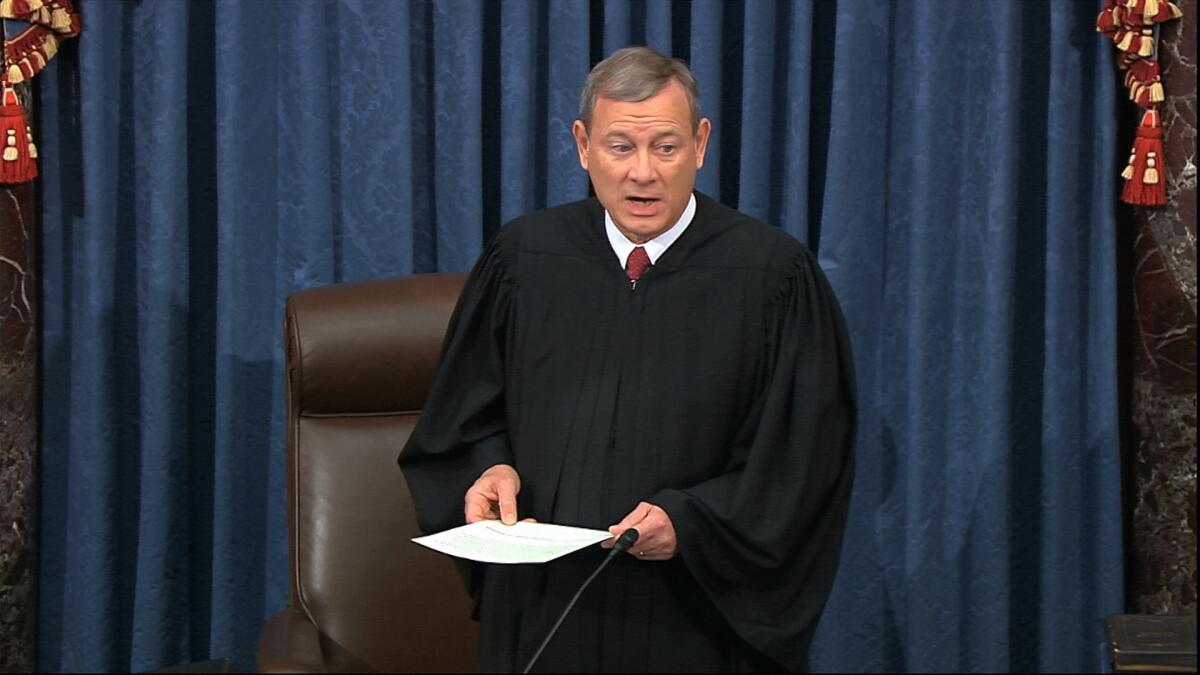 In this image from video, Supreme Court Chief Justice John Roberts prepares to swear in members of the Senate.