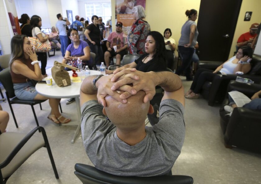 El Pasoans wait hours Sunday, Aug. 4, 2019, at United Blood Services to donate blood following Saturday's mass shooting at a Walmart in east El Paso, Texas.